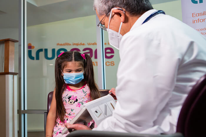 Dr. Posadas conducting an assessment