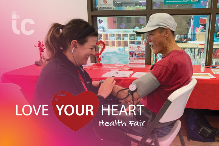 truecare-events-love-your-heart-health-fair-2024-blog-700×466 (1) TrueCare Love Your Heart Health Fair. Woman taking man's blood pressure