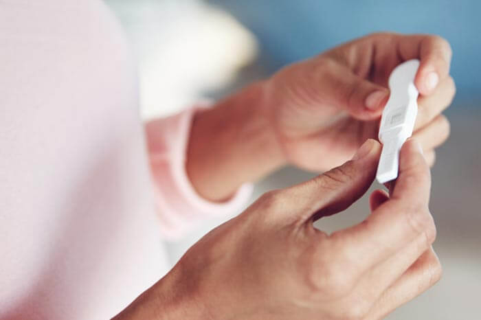 truecare-trying-to-conceive-featured-image-blog-700×466 Cropped shot of a woman waiting for the results of a pregnancy test