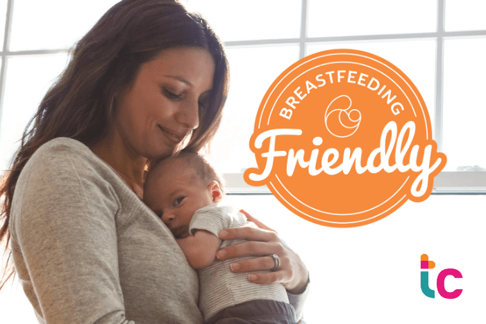 mom and infant snuggling with logo of breastfeeding friendly health center recognition.