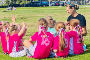 La Sra. Binette con el equipo de fútbol de su hija
